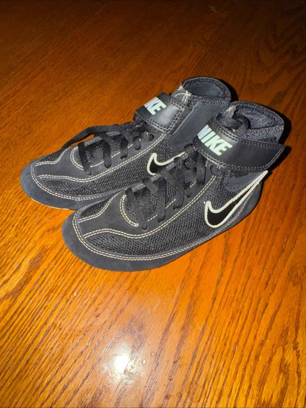 Nike Kids Black High-Top Sneakers with White Swoosh
